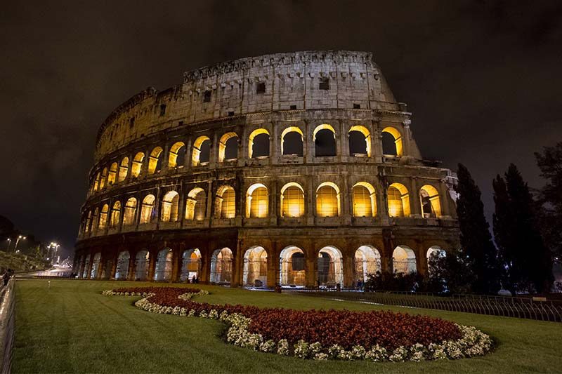roman colosseum lit up at night